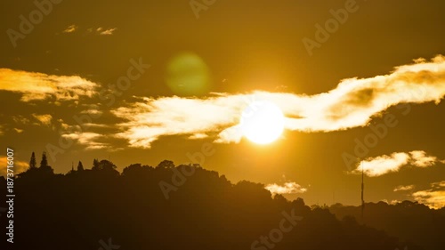 Peaceful sunset time-lapse with warm golden light and fast-moving clouds.