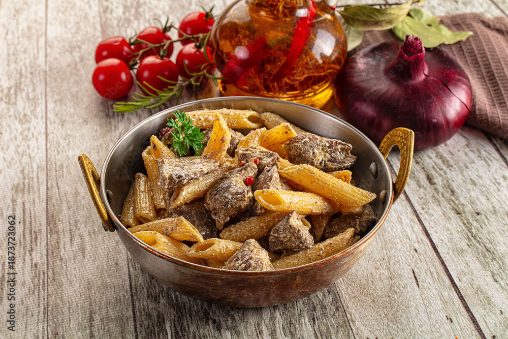 Fototapeta premium Italian pasta penne with chicken liver