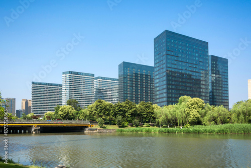 Modern Urban Landscape Featuring Stunning Architecture Surrounding Tranquil Lake