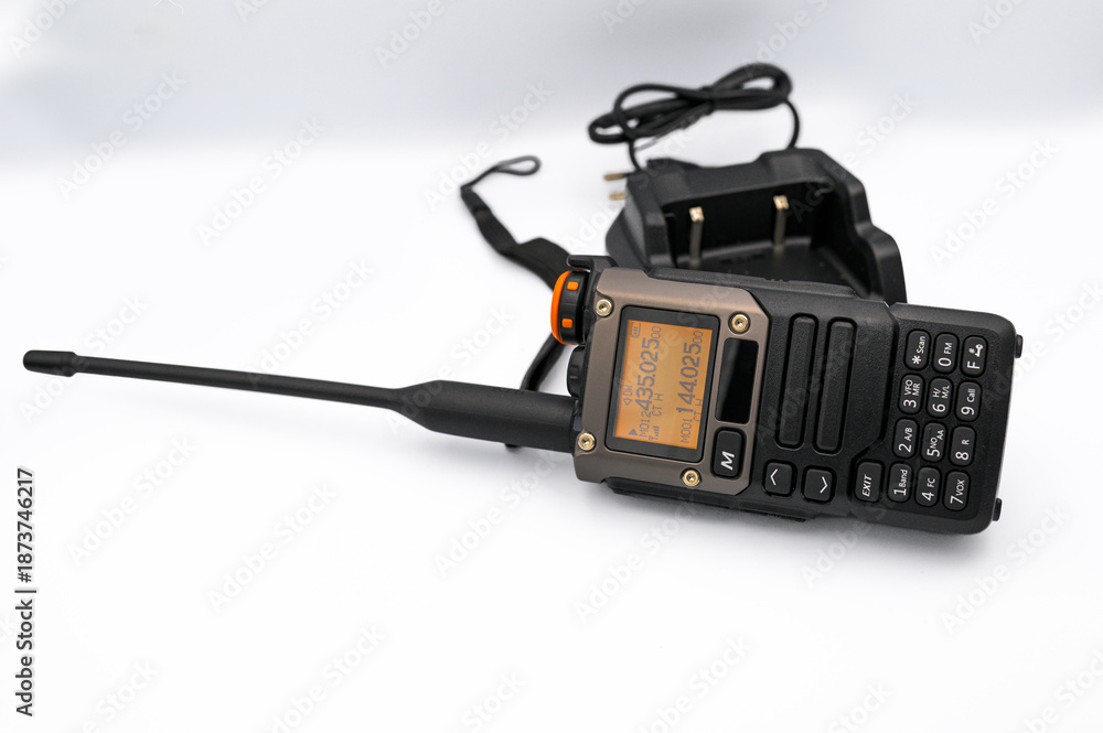 Fototapeta premium Handheld two way radio charging on white background
