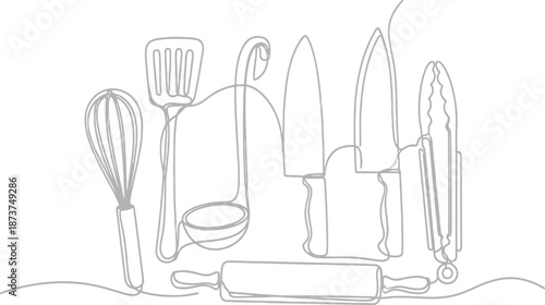 A complete set of silverware including a fork, knife, and spoon arranged as a professional kitchen utensil setting on a restaurant table for a formal dinner meal