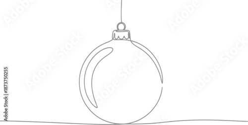A shiny silver glass Christmas ball ornament hangs as a festive winter decoration for a seasonal holiday celebration and New Year decor