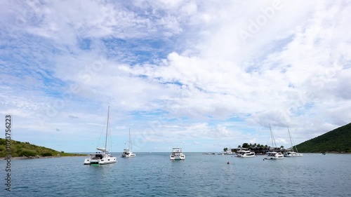 Saba, Virgin Gorda cove where sailboats and catamarans are anchored and moored in the British Virgin Islands