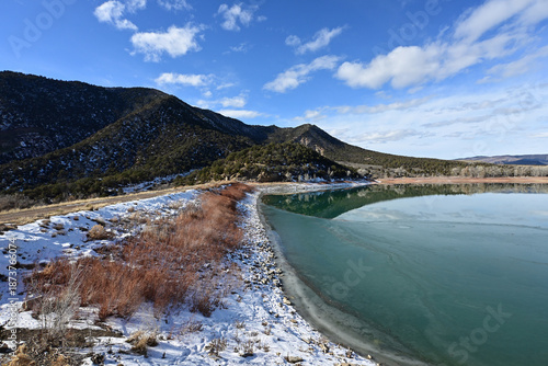 Obraz na plátne Earthen dam on Grass Valley Reservoir in Harvey Gap State Park near Rifle, Colorado on bright sunny winter morning