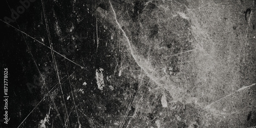 A textured and distressed surface reveals an abstract pattern of scratches and wear emphasizing age and decay