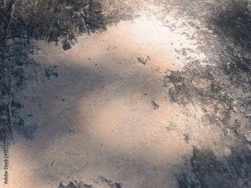 Natural stone surface mixed with soil and sand, photographed near a forest waterfall. A raw and organic texture shaped by water and time, expressing strength, balance, and connection to nature. Ideal 
