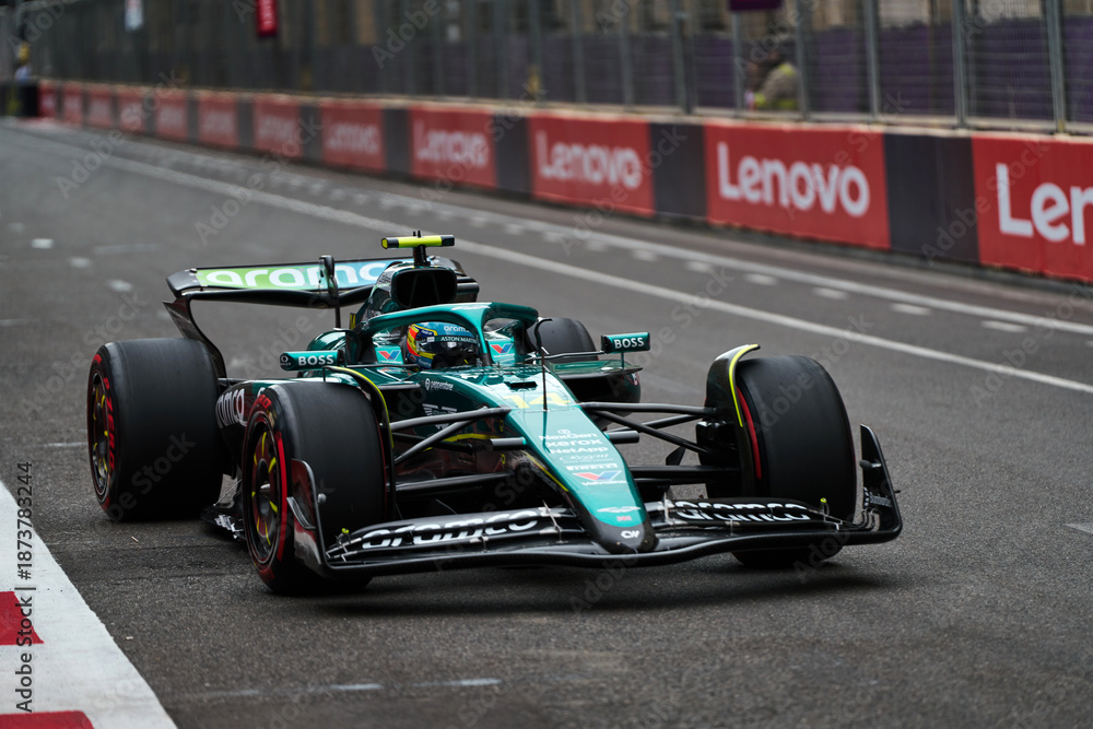 Naklejka premium BAKU, AZERBAIJAN - SEPTEMBER 20, 2025: Two-time world champion Fernando Alonso in the Aston Martin Aramco AMR25 during the Azerbaijan Grand Prix weekend