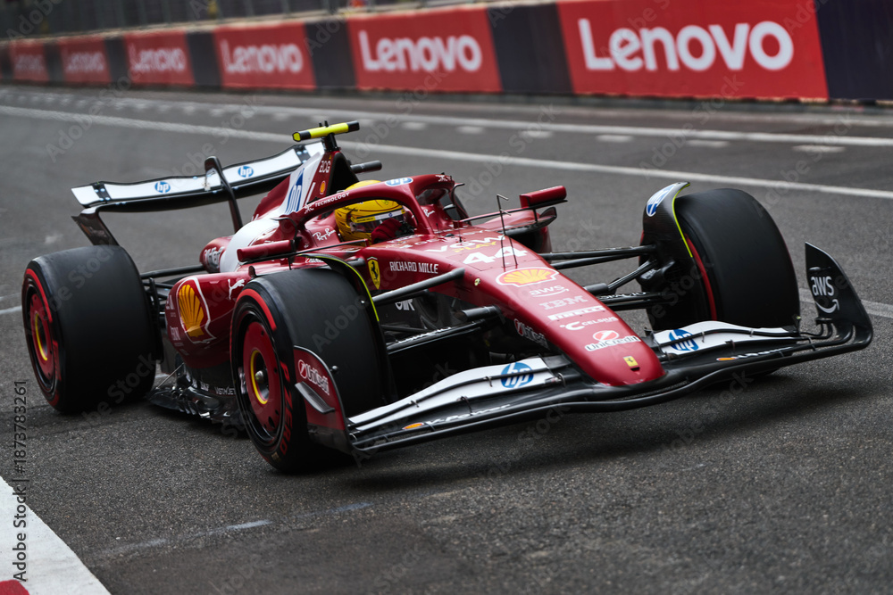 Fototapeta premium BAKU, AZERBAIJAN - SEPTEMBER 20, 2025: Seven-time World Champion Lewis Hamilton (GBR) drives the Ferrari SF-24 for Scuderia Ferrari HP. Pictured during the Azerbaijan Grand Prix in Baku
