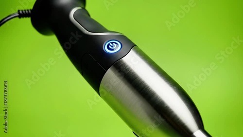 A sleek, modern electric toothbrush with a black and silver handle
