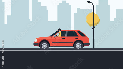 A person drives an orange car through a city with a yellow tree nearby