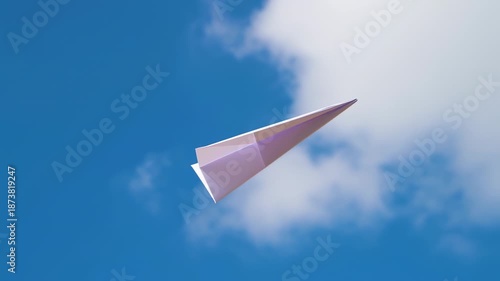 A light purple paper airplane soars against a vibrant blue sky dotted with fluffy white clouds