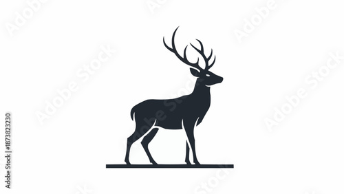 Silhouette of a majestic stag with large antlers standing proudly.