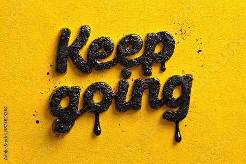 Keep Going:  An eye-catching visual featuring the motivational words Keep Going, rendered in a textured, dark font against a vibrant, solid-colored backdrop, embodies resilience and perseverance.