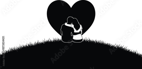 A loving couple sits together in front of a large heart on a grassy hill