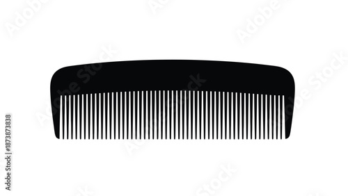 A simple black comb isolated on a bright white background neatly arranged