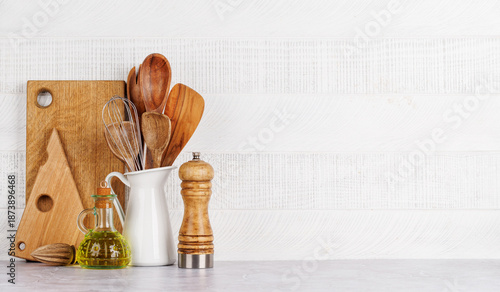 Kitchen utensils and spices on table © evgeeenius
