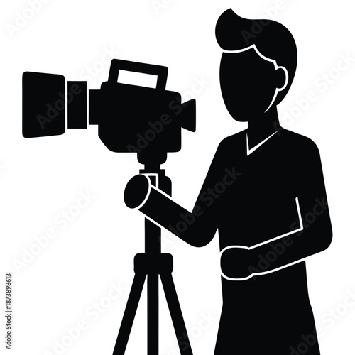 Person operating a professional video camera on a tripod for filming or recording footage