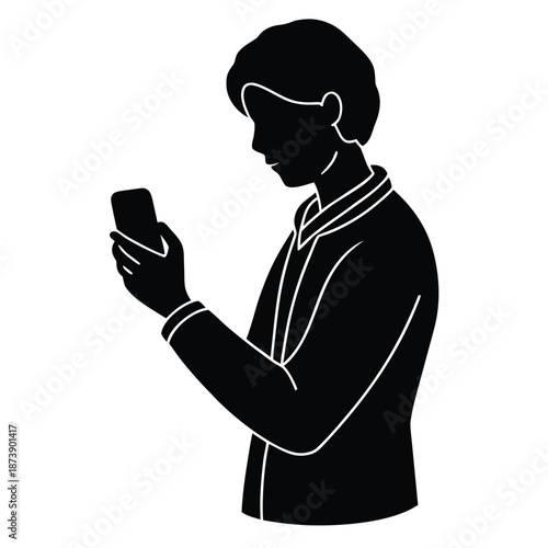 Silhouette of a young man dressed in a collared shirt looking at his mobile phone