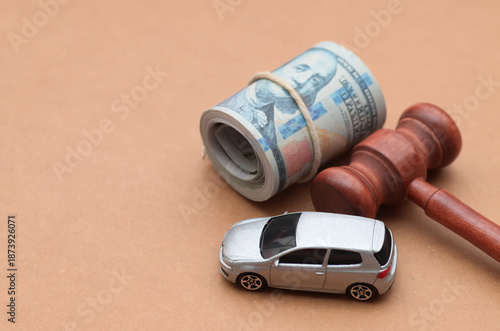 Konstfotografi Car, judge gavel, and dollar bills symbolizing legal costs, vehicle lawsuits, and financial consequences