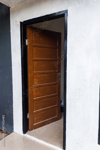 Front view of the house and the open door