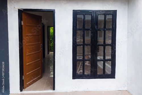 View of the front door and windows