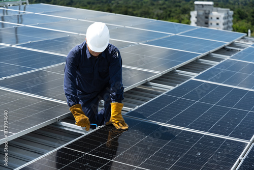 Engineer checking inspection solar cell on the roof.Technician installation solar panel on blue sky and white clouds background.Technology solar energy renewable and clean