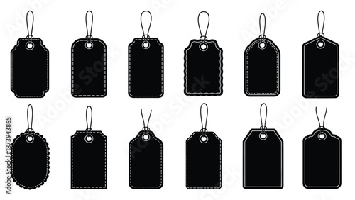 A collection of black price tags with string loops arranged in rows