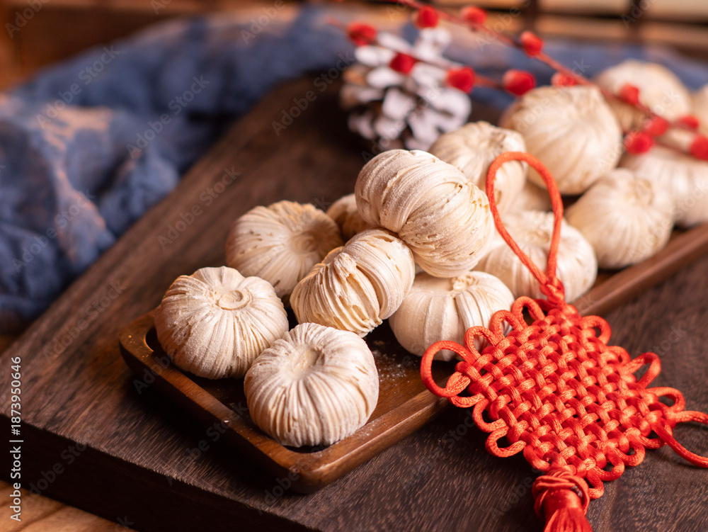 Fototapeta premium On the 23rd day of the 12th lunar month in China, people eat sugar gourd and enjoy its stickiness