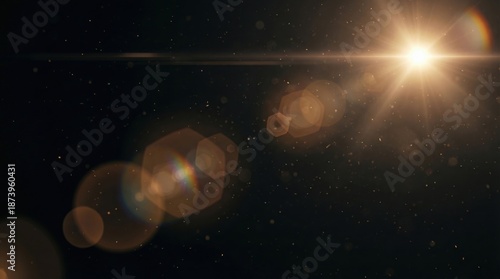 Bright sun flare with dust particles and lens flares on a dark background
