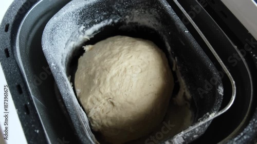dough being kneaded in a bread maker, close-up