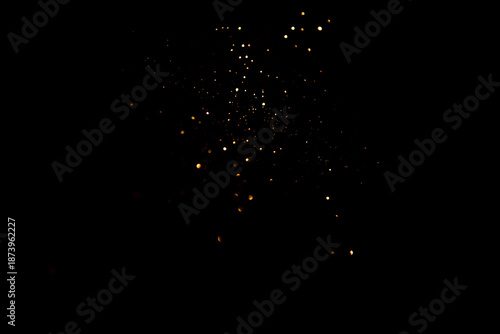 Golden abstract bokeh on black background. Holiday concept.