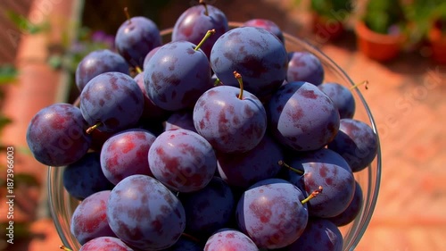 Freshly harvested plums in a glass bowl, healthy eating and vitamin source