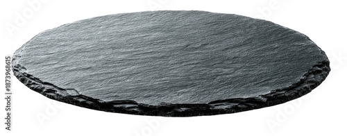 A round, dark gray, rough-edged, slate-like serving board floating on a black background