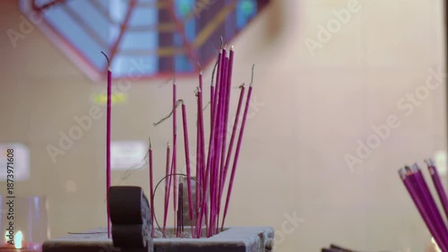 Close-up of hand put Burning Incense Sticks in a Buddhist Temple. unrecognize people put Burning Incense Sticks for praying