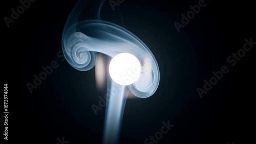 Wallpaper Mural A stunning abstract video showcasing a bright light surrounded by swirling smoke in a dark space Torontodigital.ca