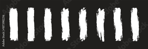 White rough paint brush strokes set on dark background, vertical grunge textures ideal for abstract art, modern graphic design, posters, overlays, and creative visual effects.