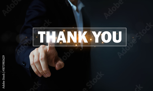 Businessman pressing virtual thank you button on digital interface, showing appreciation, gratitude, customer service, business communication, technology concept with copy space on dark background.