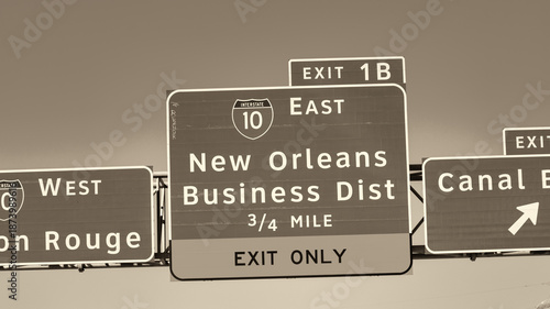 Foto Urban street scene in New Orleans with multiple directional road signs