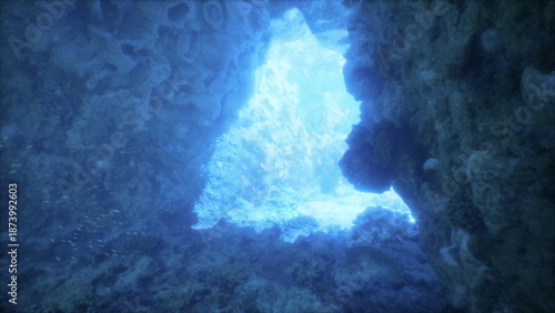 Wallpaper Mural Waves gently flow through a stunning underwater cave where brilliant light filters in, creating a magical atmosphere. Coral formations and marine life enhance this serene location. Torontodigital.ca