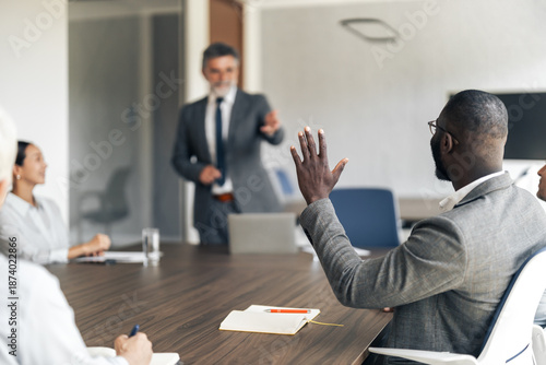 Canvas Print Business team collaborating during meeting, man asking question