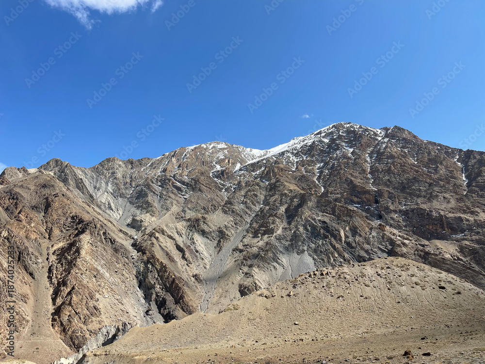 Fototapeta premium Mountain range with snow and clear blue sky near Leh in Ladakh during daytime