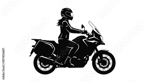 Silhouette of a female motorcyclist riding an adventure touring bike