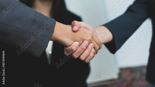 Obraz na plátně Close up of business people shaking hands, successful partnership, agreement, trust, corporate deal, teamwork, negotiation, professional collaboration concept