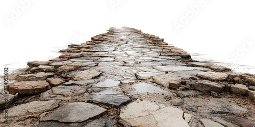 Perspective shot of cobblestone path leading to light against a black background