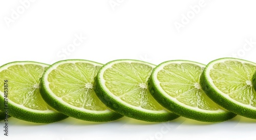 Close up macro shot of fresh juicy green lime slices arranged horizontally across a clean white background, ready for drink preparation, fresh, vibrant, lime