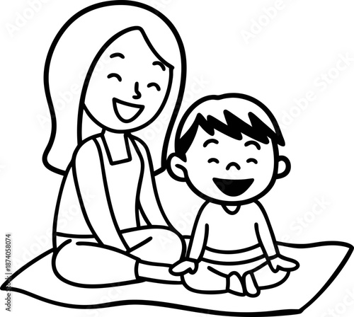 Mother and child sitting happily together on a blanket, enjoying quality time and bonding
