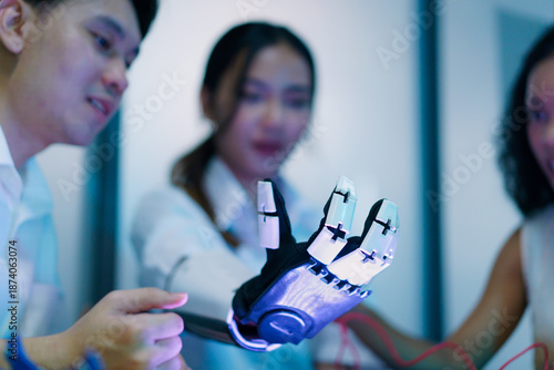 Diverse engineering students team developing robotic technology in laboratory