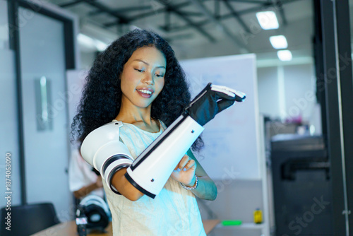 Diverse engineering students team developing robotic technology in laboratory