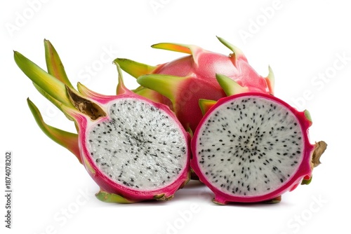 A vibrant pink dragon fruit with green scales and white flesh dotted with tiny black seeds is cut in half to reveal its interior texture and composition.