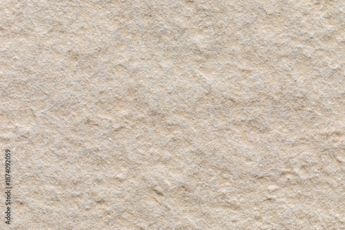 Close-up of the beige surface of the rough gres tile, classified as the highest slip resistance class (R13). 
